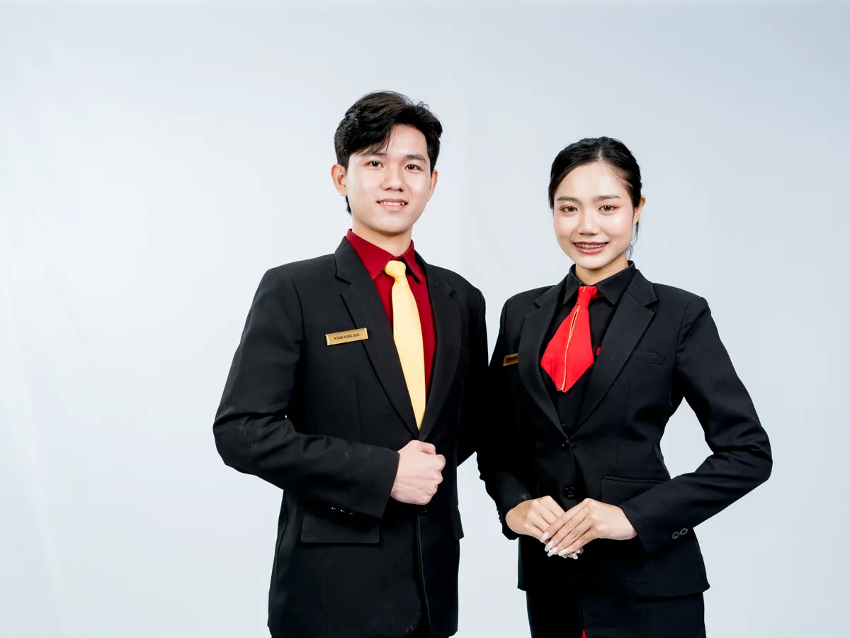 Tourism and hospitality students in black suits